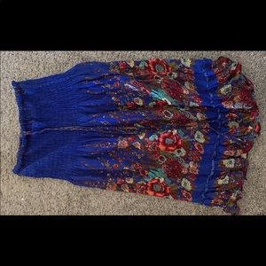 A dress with neck straps with flow prints